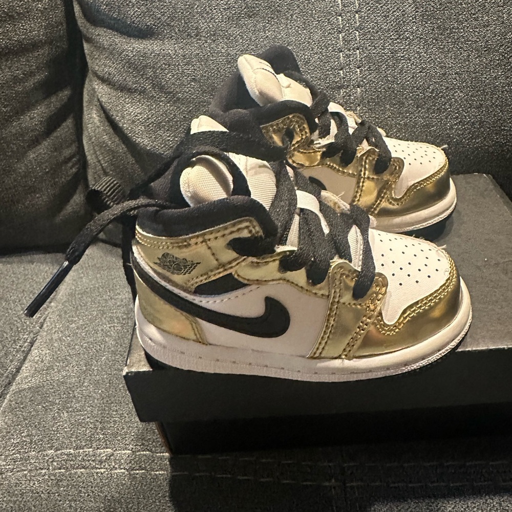 Kids Gold and Black Nike Shoes